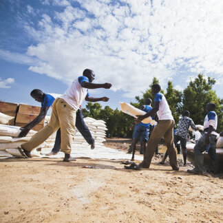 WFP staff are carrying sacks